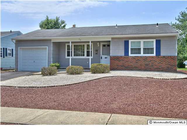 54 Oakfield Road Toms River, NJ 08757 - Photo 1 of 25 a front view of a house with garden