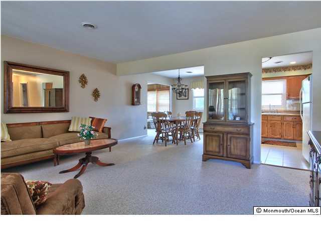 54 Oakfield Road Toms River, NJ 08757 - Photo 5 of 25 a living room with furniture and view of kitchen