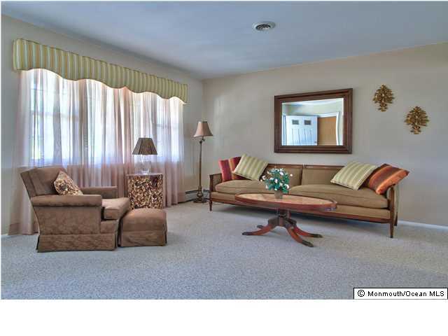 54 Oakfield Road Toms River, NJ 08757 - Photo 6 of 25 a living room with furniture and a window