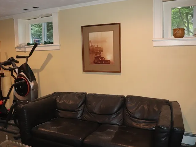 a living room with furniture and a window