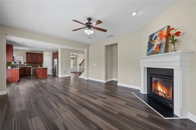 a view of an empty room and fire place