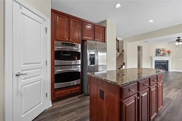 a kitchen with a refrigerator and countertop