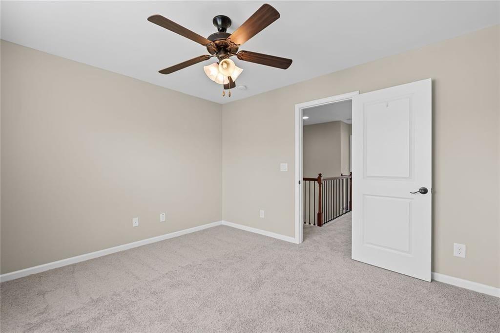 29 Lankford Road Tucker, GA 30084 - Photo 26 of 43 an empty room with closet and a ceiling fan