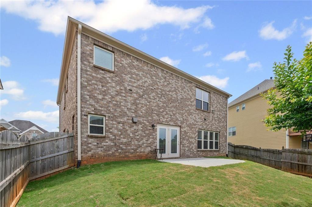 29 Lankford Road Tucker, GA 30084 - Photo 35 of 43 a backyard of a house with a yard and garage