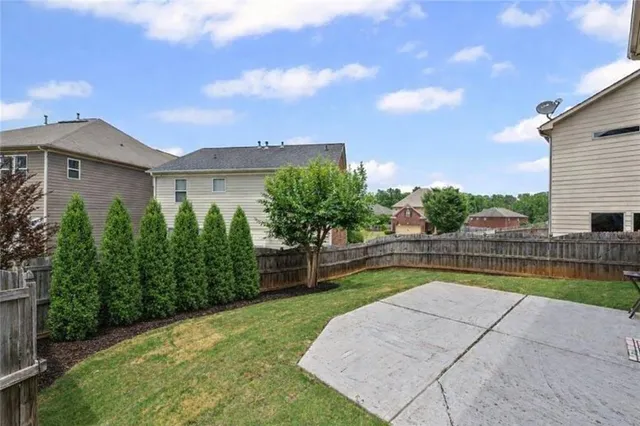 a view of a swimming pool with a patio
