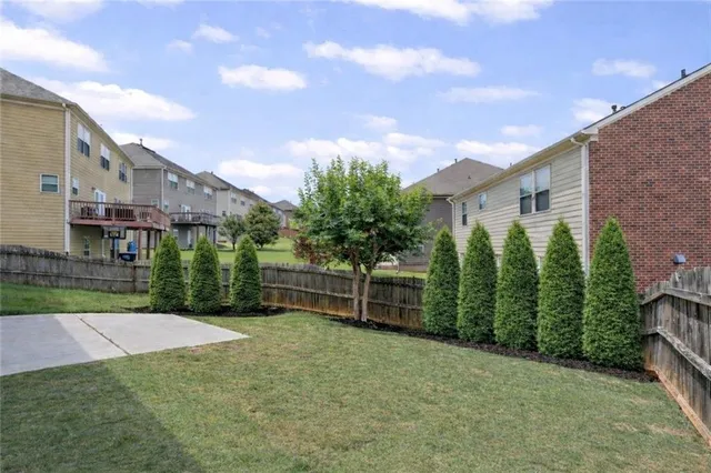 a backyard of a house with lots of green space