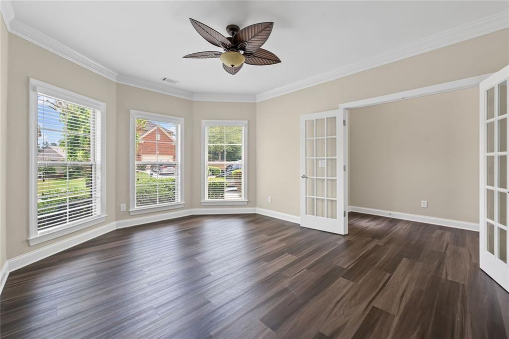 29 Lankford Road Tucker, GA 30084 - Photo 4 of 43 a view of wooden floor and a chandelier fan in a room