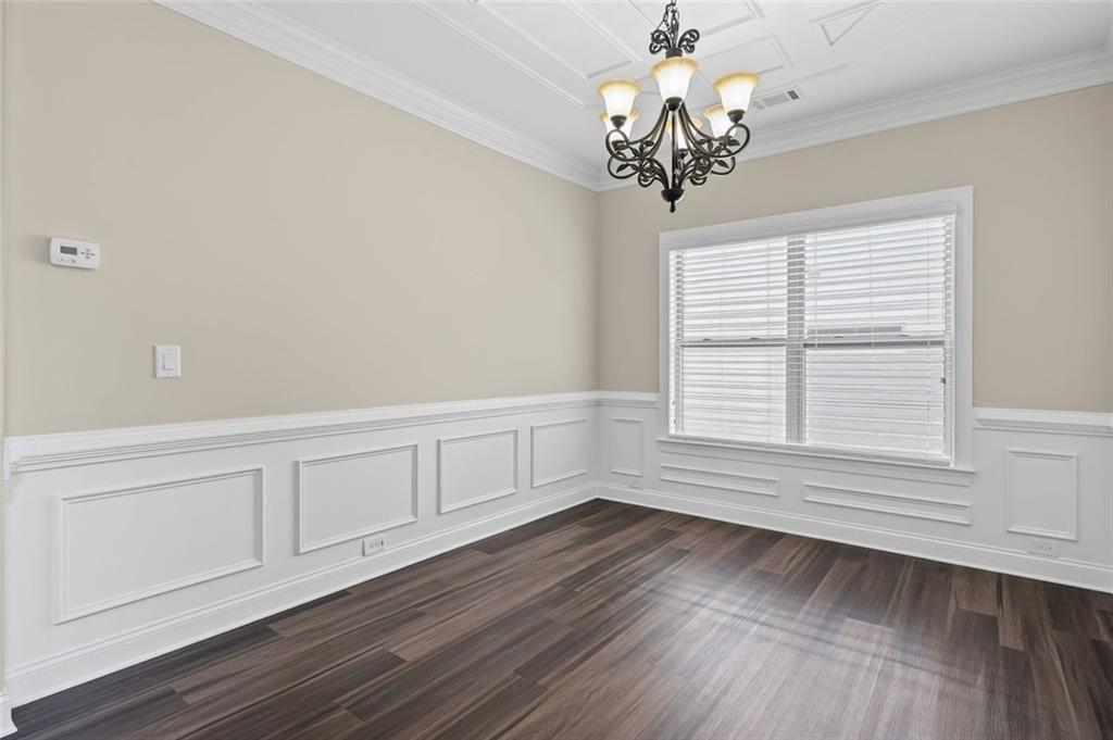 29 Lankford Road Tucker, GA 30084 - Photo 6 of 43 a view of an empty room with wooden floor and a window