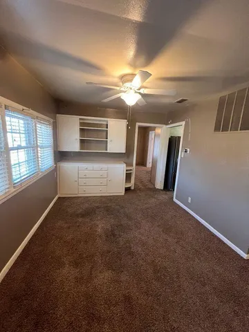 a view of empty room with windows
