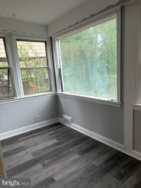 3024 M Street Southeast Washington, DC 20019 - Photo 6 of 8 an empty room with wooden floor and windows