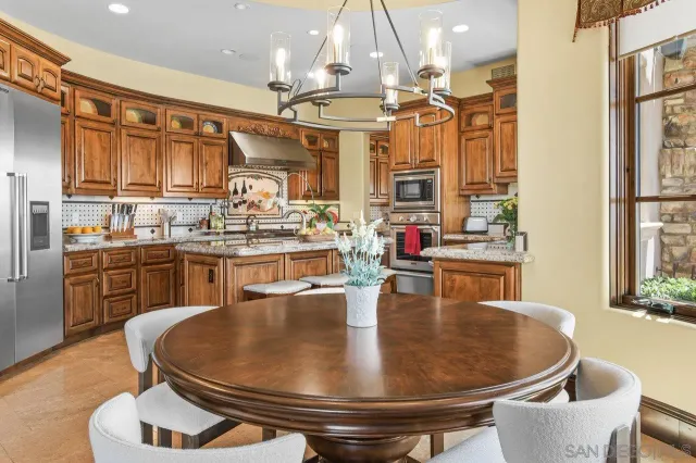 a kitchen with a stove a sink and a refrigerator