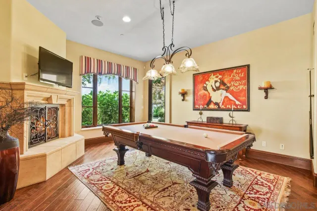 a living room with fireplace furniture and a flat screen tv