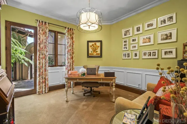 a work room with furniture and a window