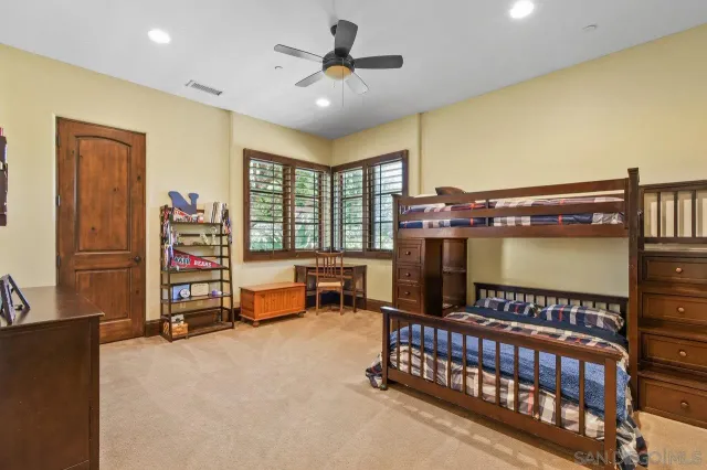 a bedroom with furniture and a window