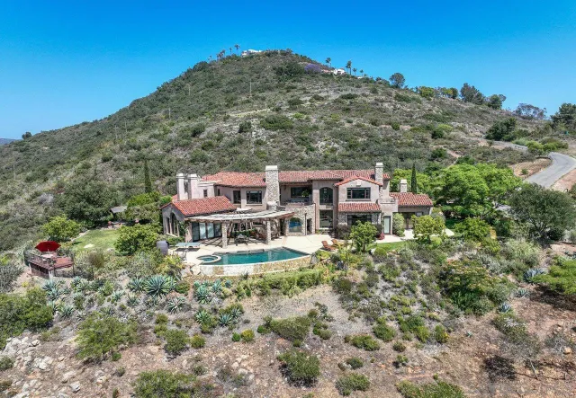 a aerial view of a house with a yard