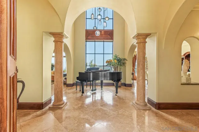 a view of a dining room with furniture and a window