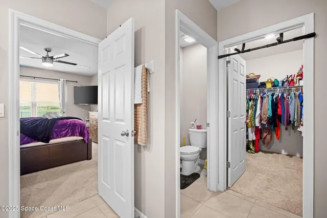 a view of a bedroom with a couch and a window