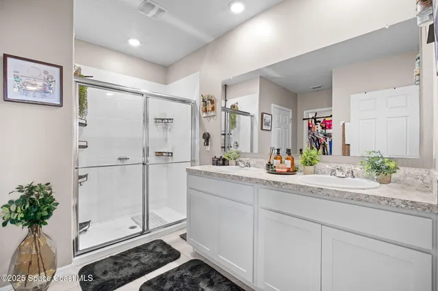a bathroom with a shower and a mirror