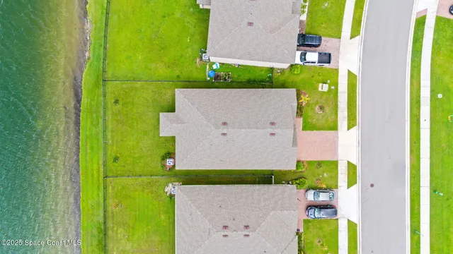 an aerial view of a house with a swimming pool