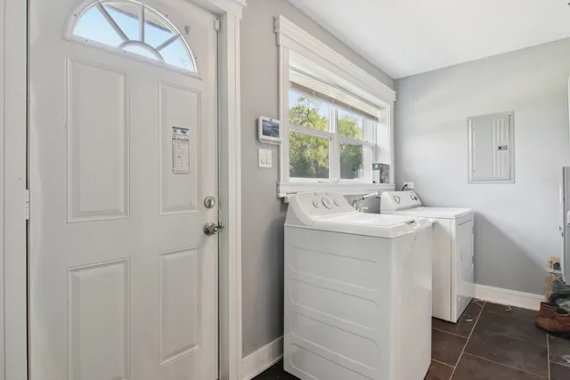 a bathroom with a sink mirror and window