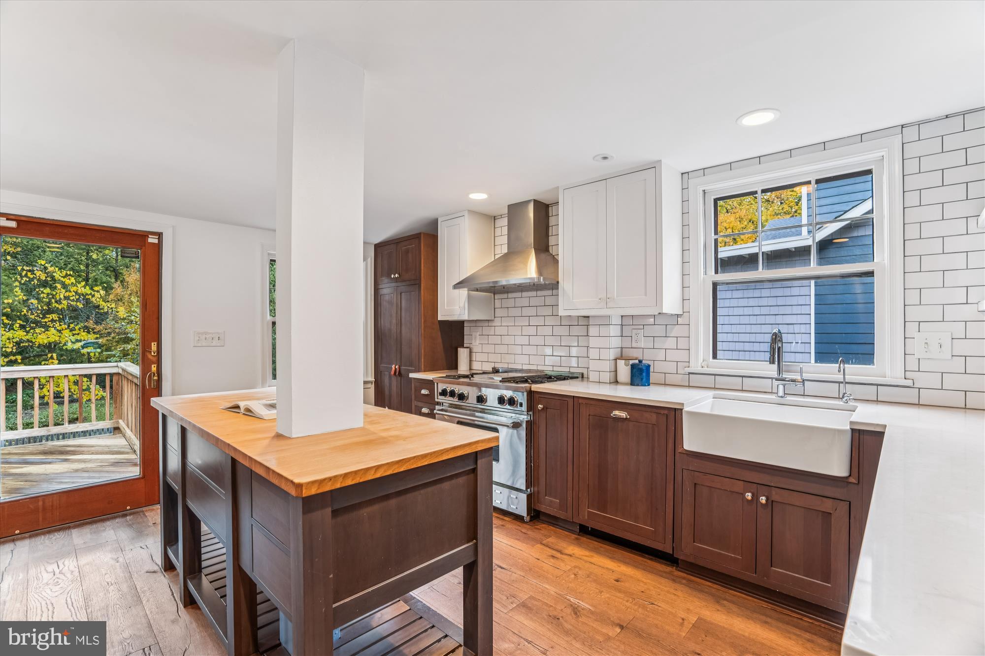 751 Silver Spring Avenue Silver Spring, MD 20910 - Photo 17 of 71 a kitchen with a stove a sink a refrigerator and wooden cabinets