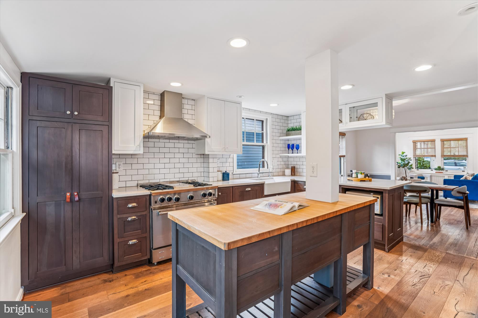 751 Silver Spring Avenue Silver Spring, MD 20910 - Photo 18 of 71 a kitchen with a stove a sink a refrigerator and chairs