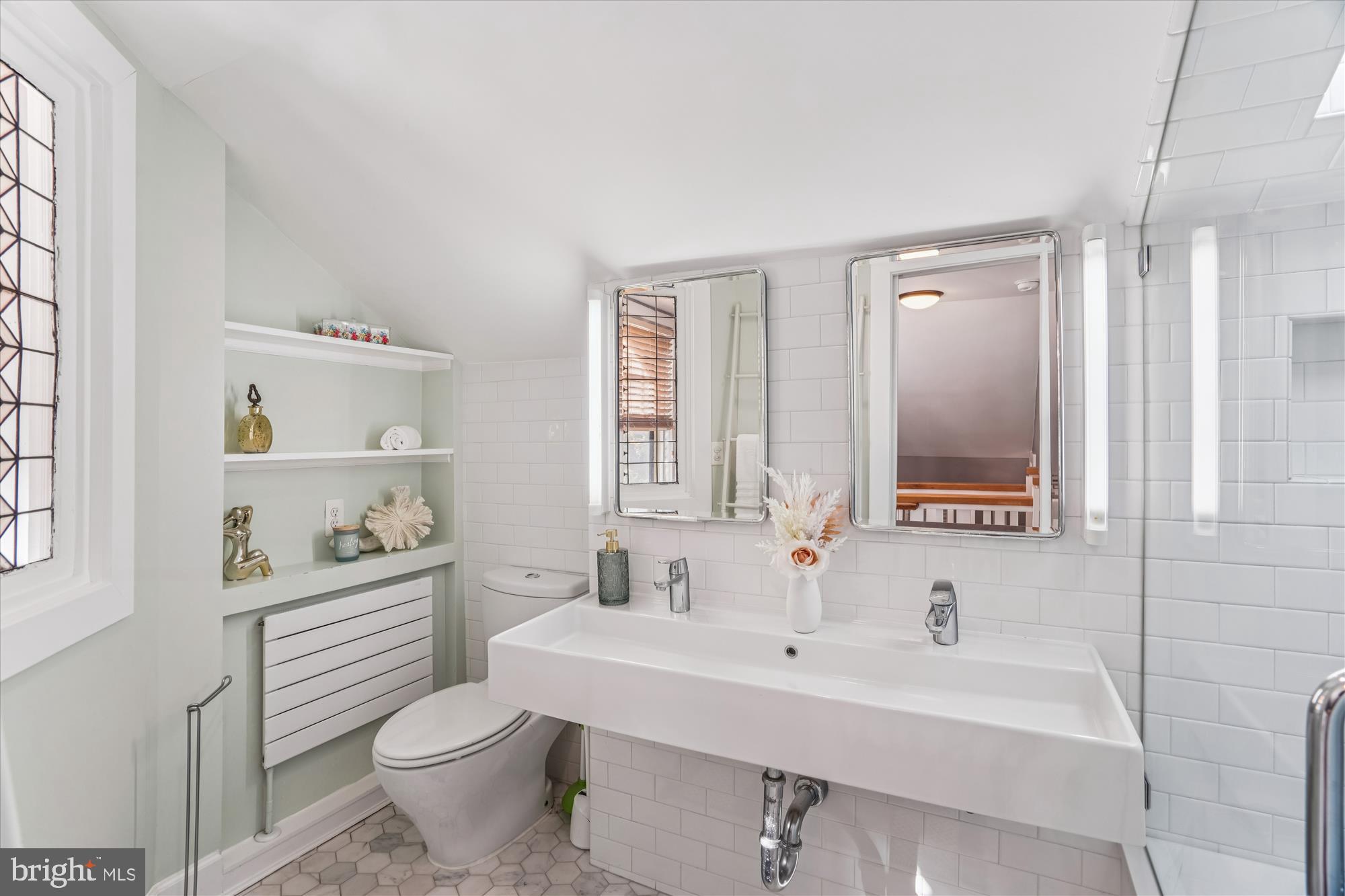 751 Silver Spring Avenue Silver Spring, MD 20910 - Photo 39 of 71 a bathroom with a sink toilet and a mirror