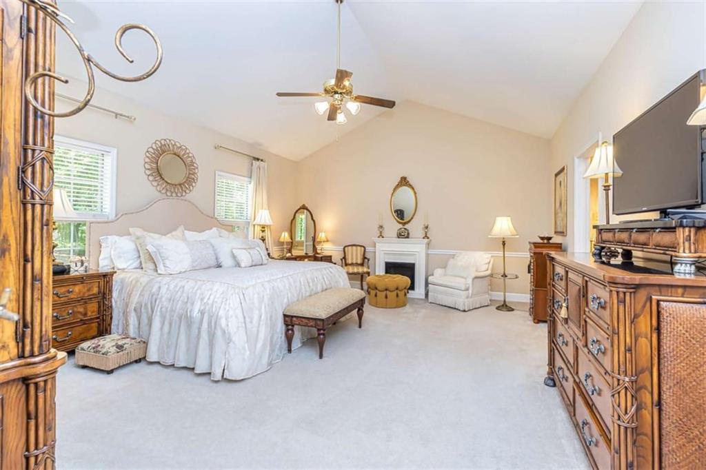 6009 Big A Road Douglasville, GA 30135 - Photo 18 of 50 a bedroom with bed and a chandelier