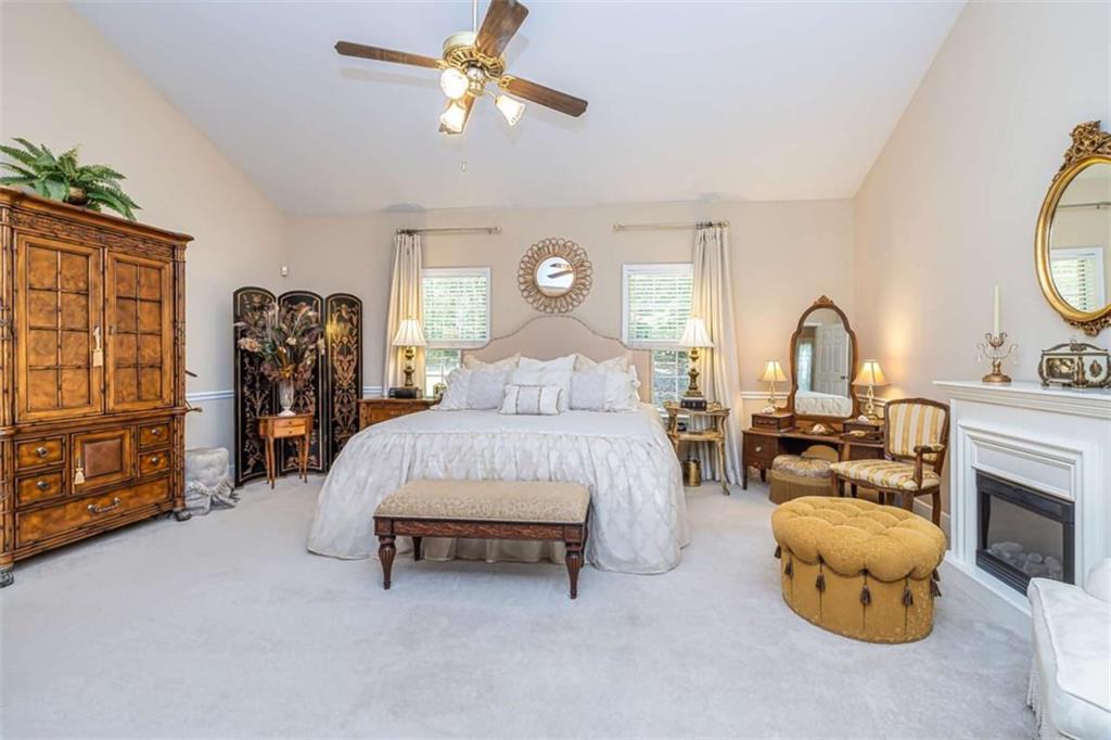 6009 Big A Road Douglasville, GA 30135 - Photo 19 of 50 a bedroom with bed and a chandelier