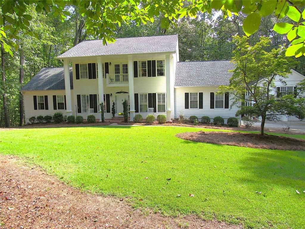 6009 Big A Road Douglasville, GA 30135 - Photo 2 of 50 a front view of a house with yard and green space