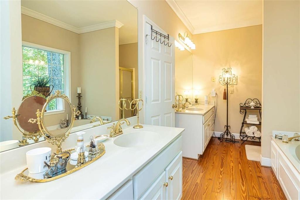 6009 Big A Road Douglasville, GA 30135 - Photo 23 of 50 a spacious bathroom with a double vanity sink and mirror