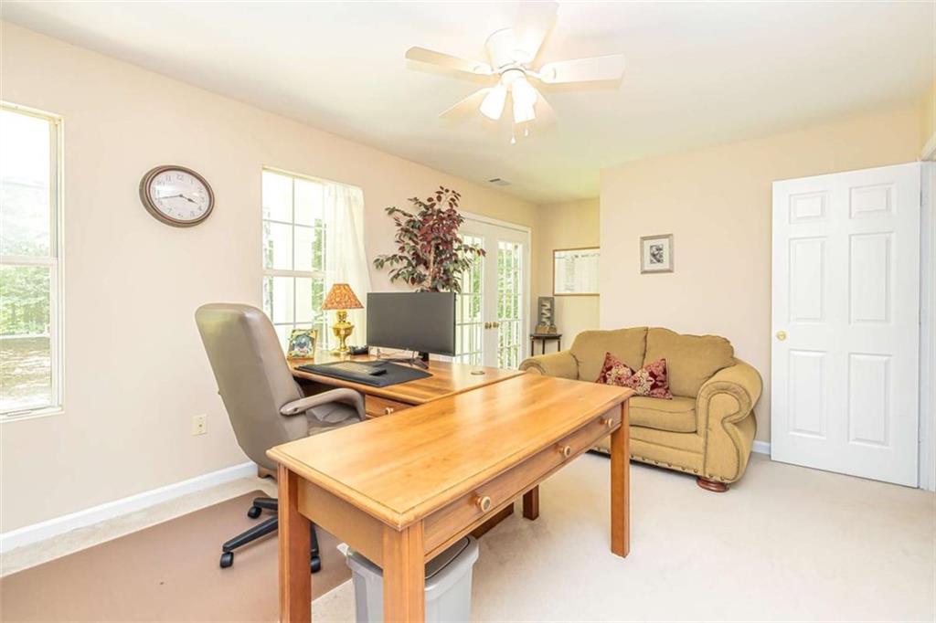 6009 Big A Road Douglasville, GA 30135 - Photo 25 of 50 a living room with furniture a chandelier and a window