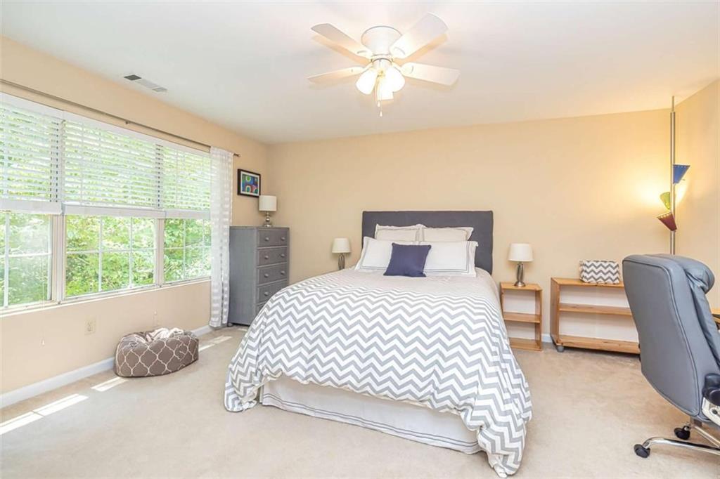 6009 Big A Road Douglasville, GA 30135 - Photo 26 of 50 a bedroom with a bed painting on wall and a large window