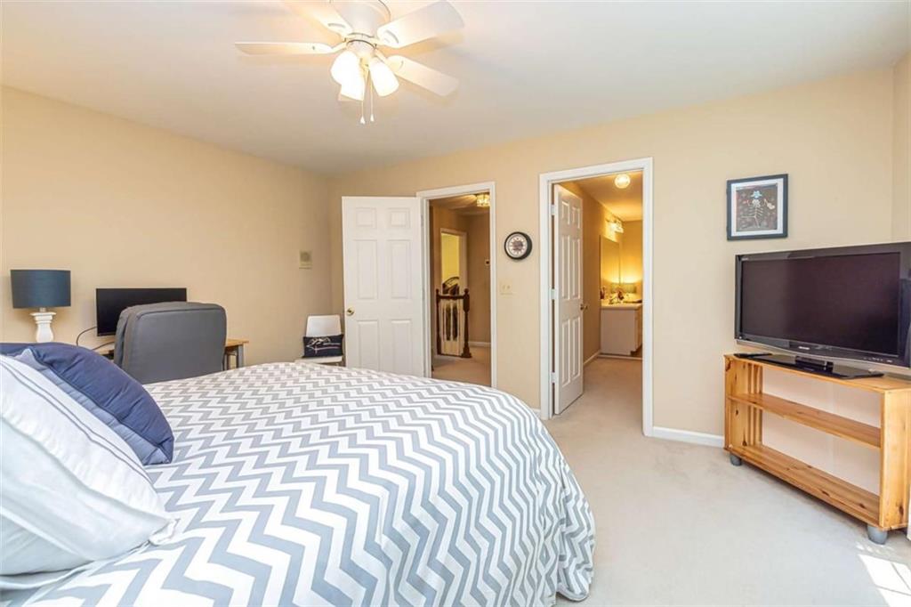 6009 Big A Road Douglasville, GA 30135 - Photo 27 of 50 a bedroom with a bed and a flat screen tv