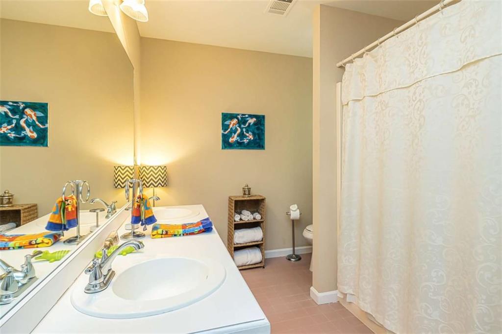 6009 Big A Road Douglasville, GA 30135 - Photo 29 of 50 a bathroom with a sink and a mirror