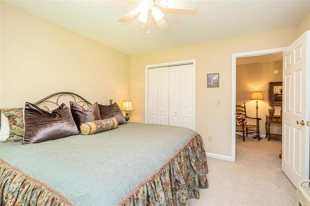 6009 Big A Road Douglasville, GA 30135 - Photo 32 of 50 a bedroom with a bed and a mirror