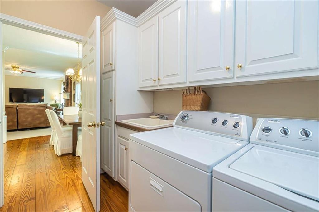 6009 Big A Road Douglasville, GA 30135 - Photo 33 of 50 a view of washer and dryer with kitchen view