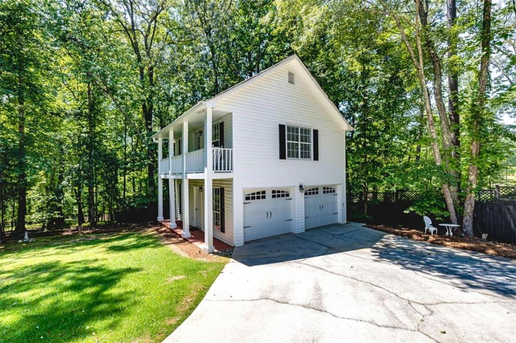6009 Big A Road Douglasville, GA 30135 - Photo 36 of 50 a view of a house with backyard and garden