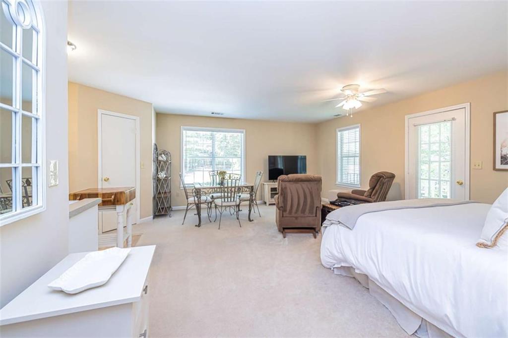 6009 Big A Road Douglasville, GA 30135 - Photo 38 of 50 a bed room with bed and a chair