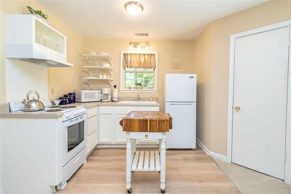 6009 Big A Road Douglasville, GA 30135 - Photo 41 of 50 a kitchen with a sink cabinets and window