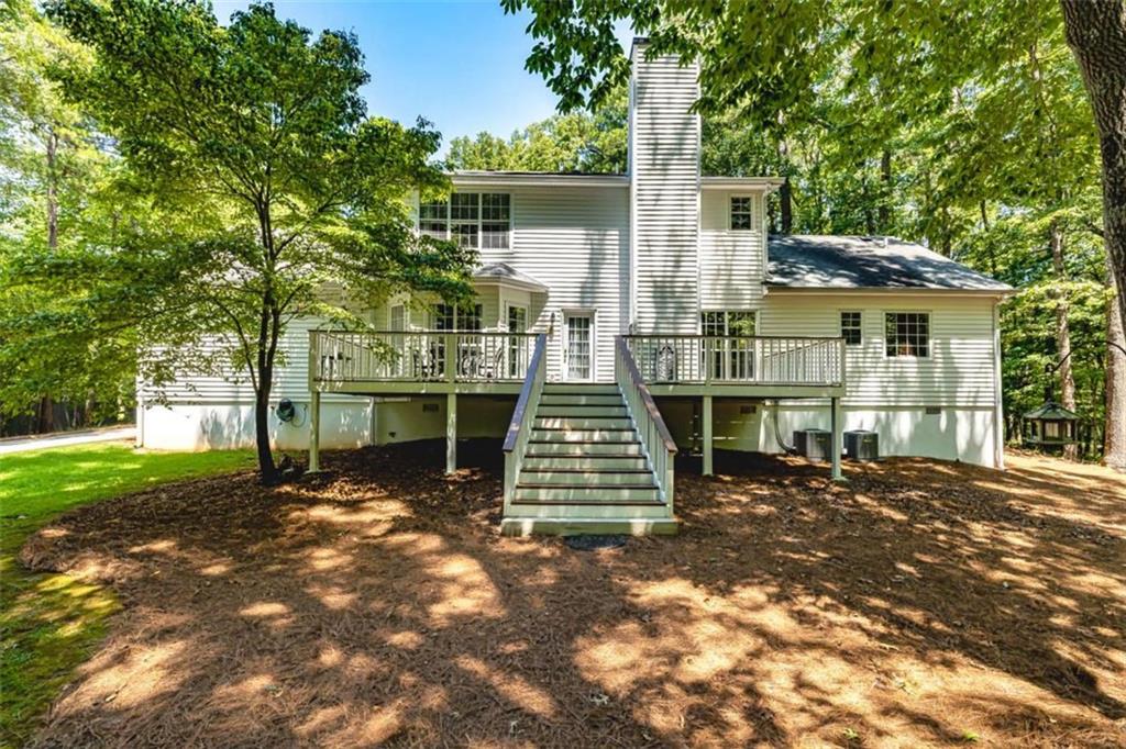 6009 Big A Road Douglasville, GA 30135 - Photo 44 of 50 a front view of a house with a garden