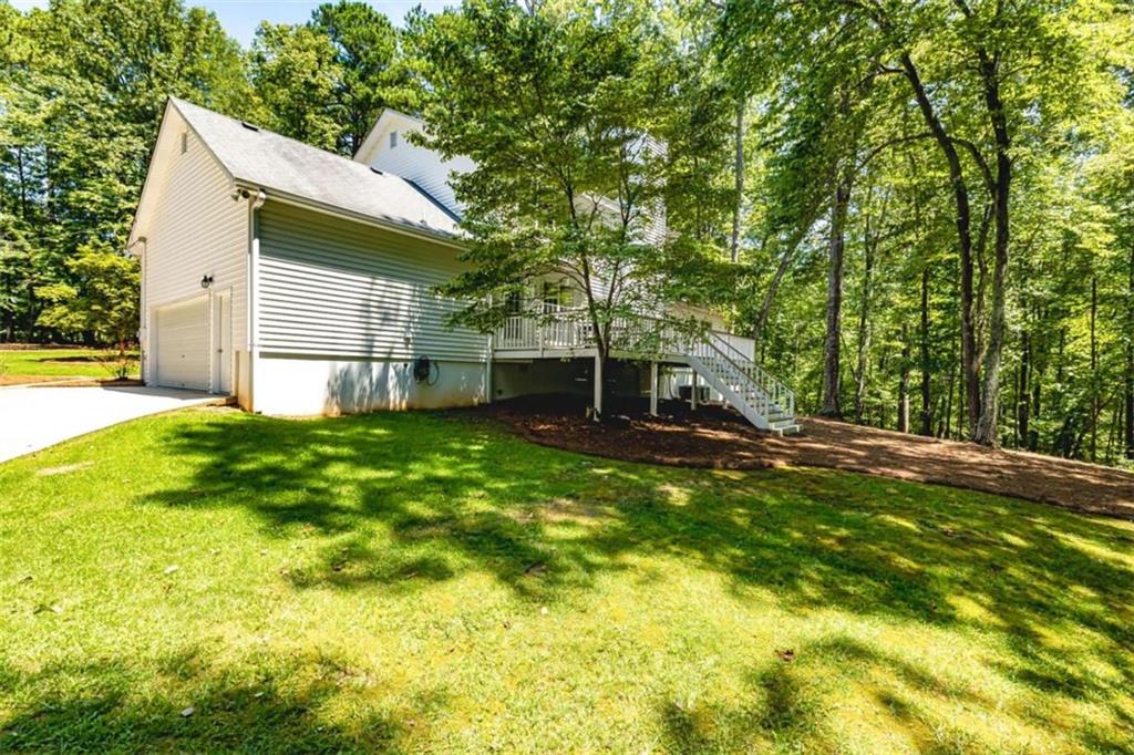 6009 Big A Road Douglasville, GA 30135 - Photo 45 of 50 a backyard of a house with table and chairs