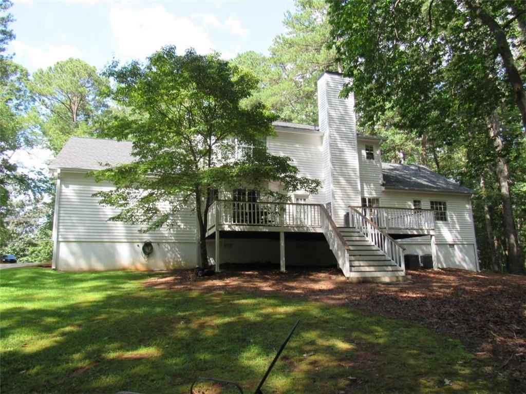 6009 Big A Road Douglasville, GA 30135 - Photo 50 of 50 a front view of a house with a garden and tree
