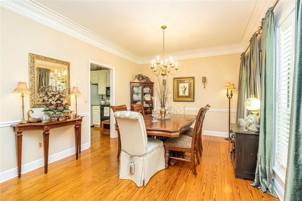 6009 Big A Road Douglasville, GA 30135 - Photo 7 of 50 a view of a dining room with furniture a chandelier and wooden floor