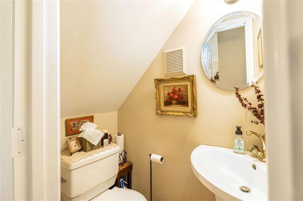 6009 Big A Road Douglasville, GA 30135 - Photo 10 of 50 a bathroom with a toilet sink and mirror