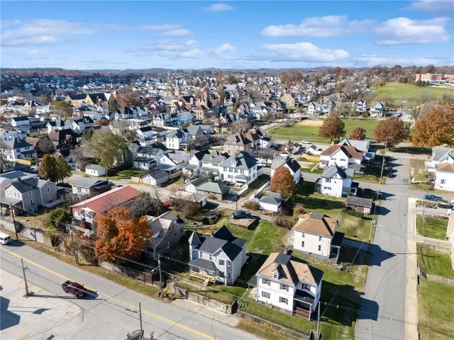 an aerial view of residential building with parking space