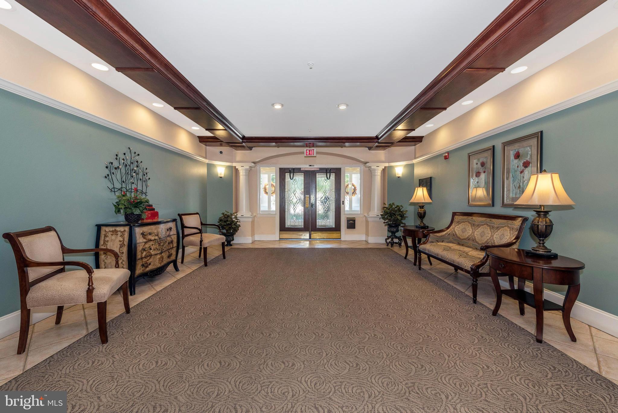 2500 Waterside Drive, Unit 315 Frederick, MD 21701 - Photo 2 of 42 Inviting foyer of controlled access building.