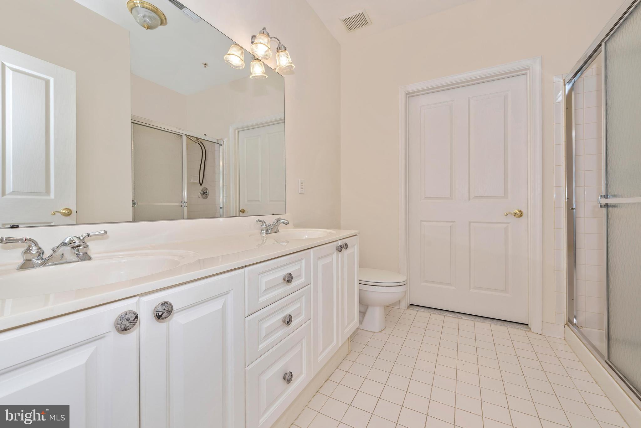 2500 Waterside Drive, Unit 315 Frederick, MD 21701 - Photo 21 of 42 Master bathroom. Dual sinks. Access to laundry.
