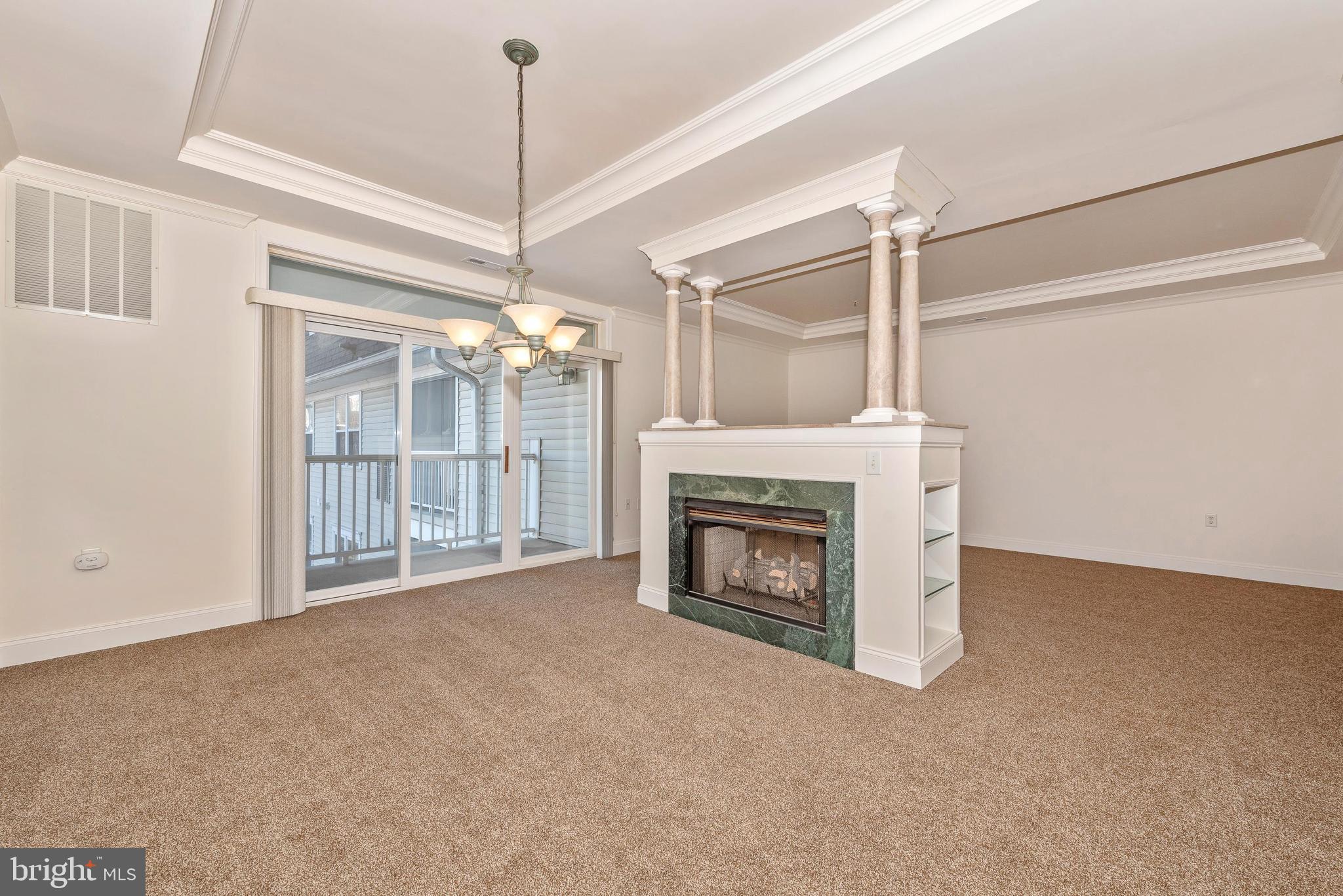 2500 Waterside Drive, Unit 315 Frederick, MD 21701 - Photo 7 of 42 Gas fire place with columns and built in shelving.