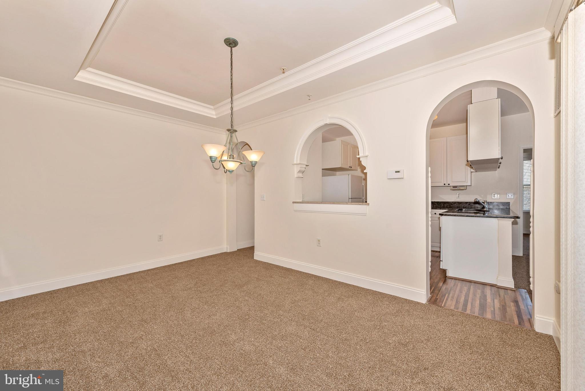 2500 Waterside Drive, Unit 315 Frederick, MD 21701 - Photo 8 of 42 Dining room with arched passage window to kitchen.